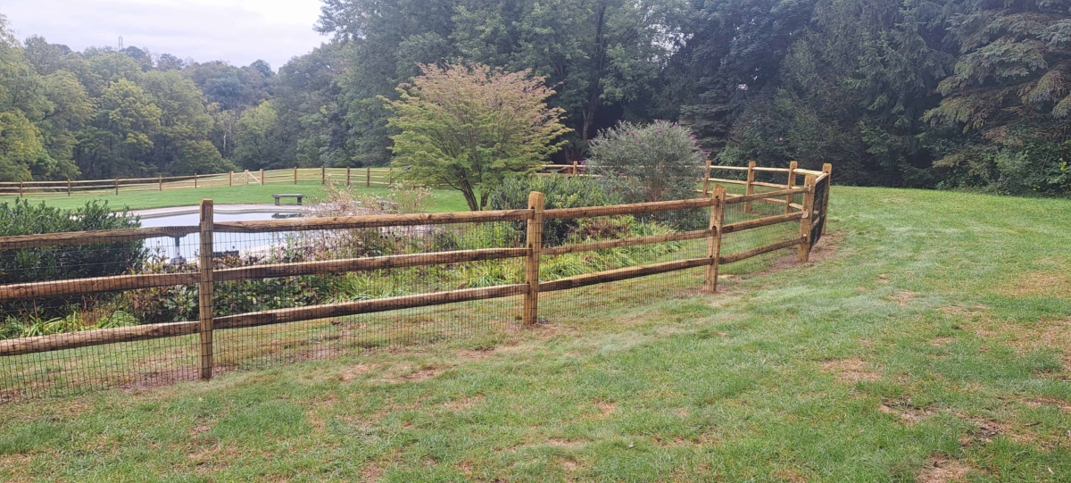 wood split rail fence with wire mesh