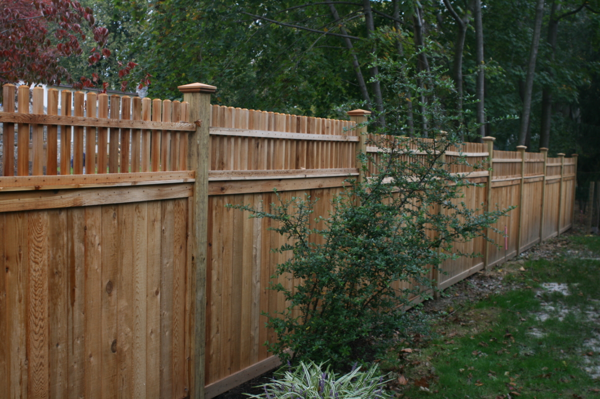 6' tall fence with framed sections and spindle top