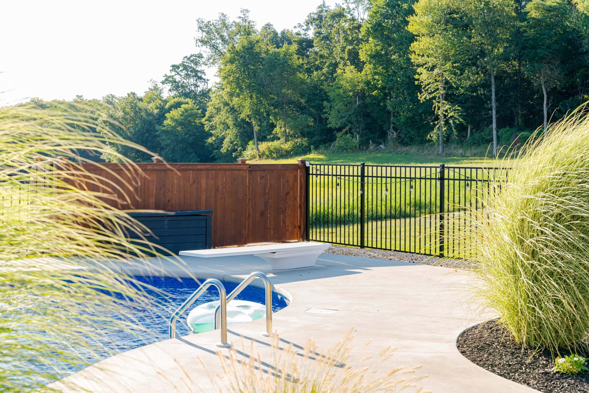 4' black aluminum pool fence and cedar enclosure