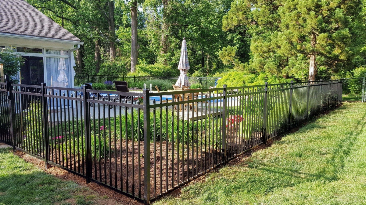 black metal fence around pool