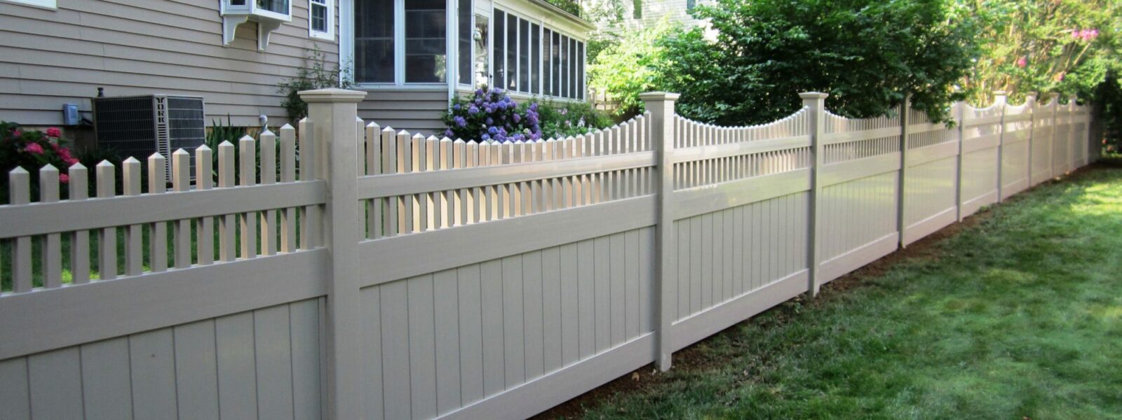 Vinyl privacy fence in back yard