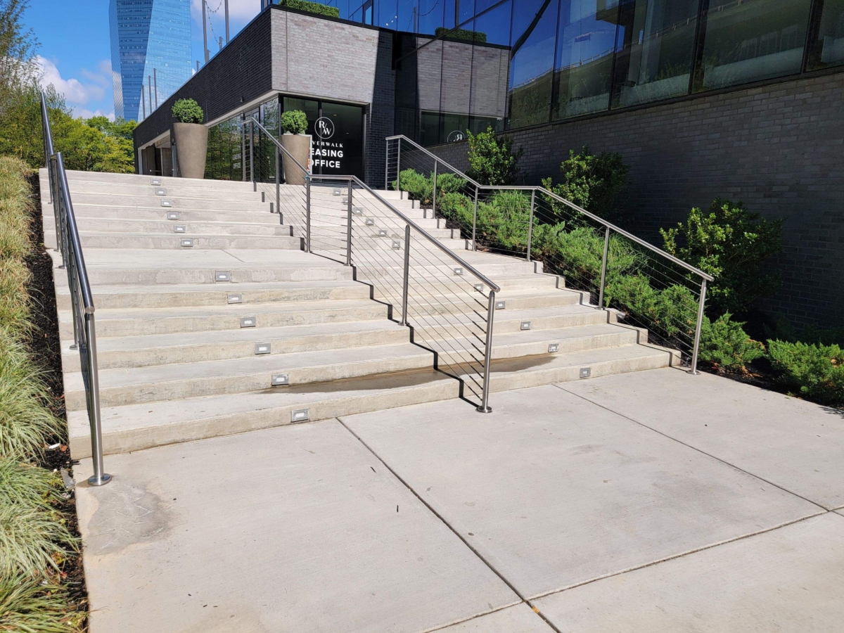 silver cable railing on stairs