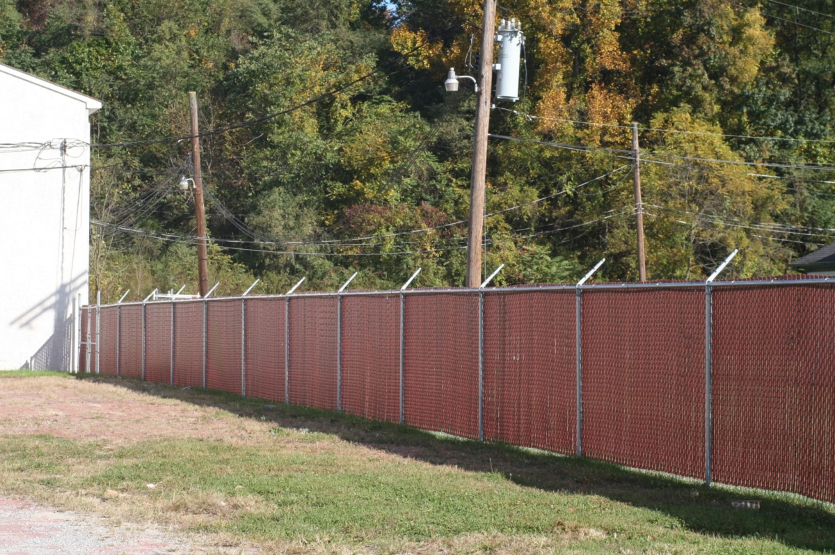 6' tall chain link fence with red privacy slats