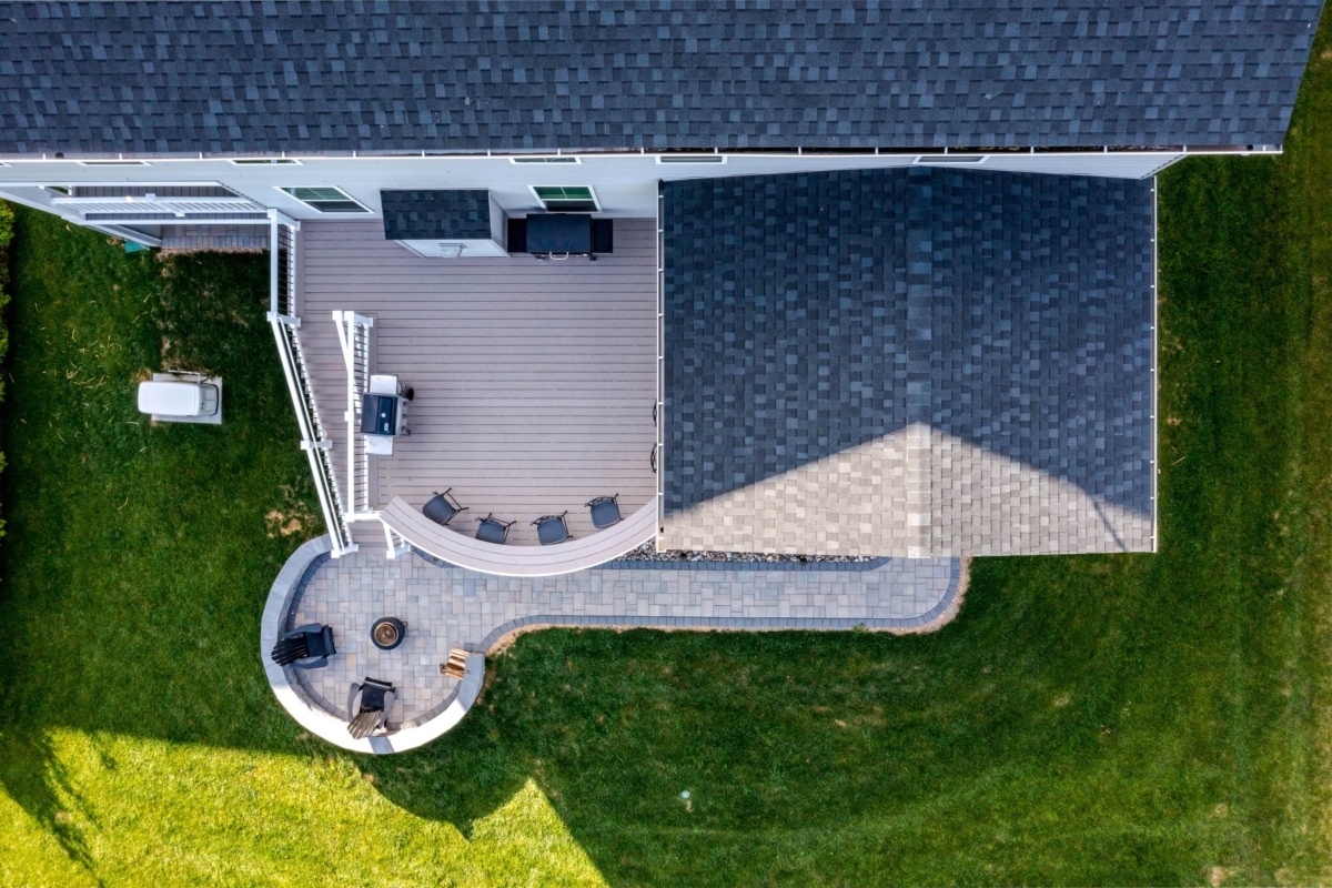 partially covered deck with curved patio