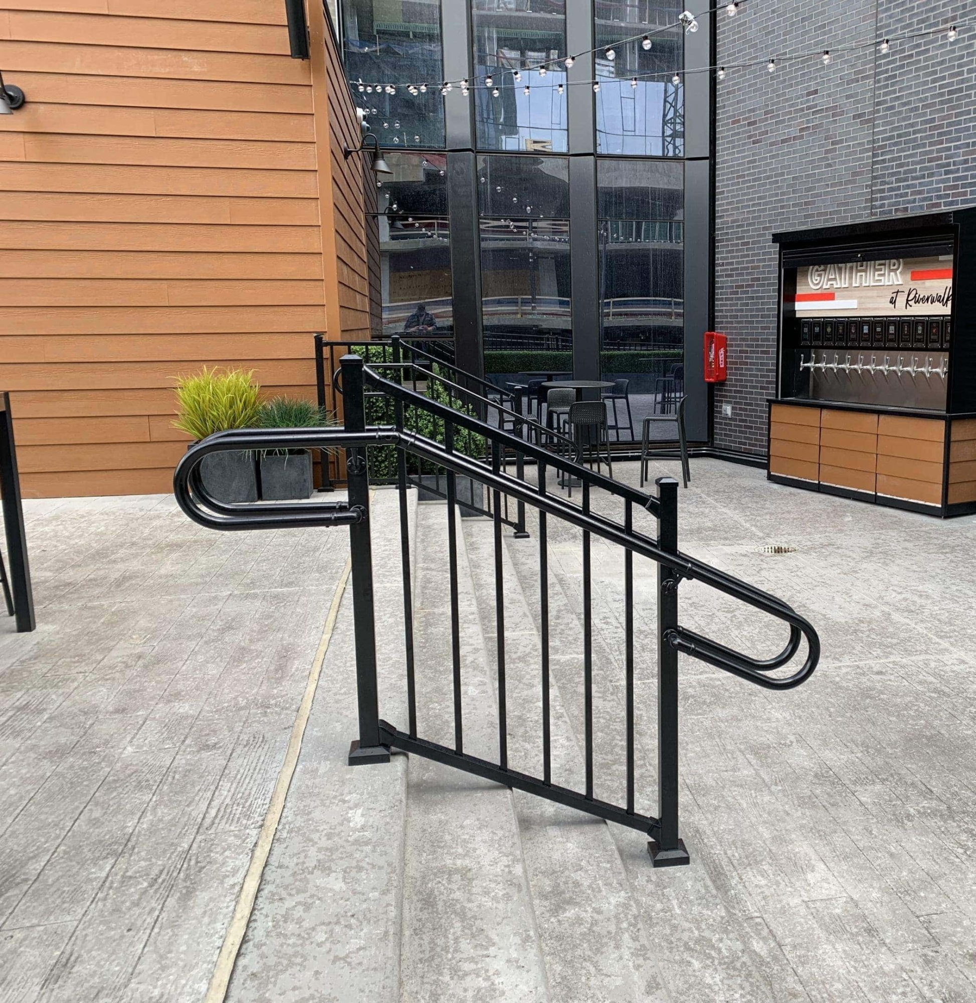 black metal railing with curved guiderail