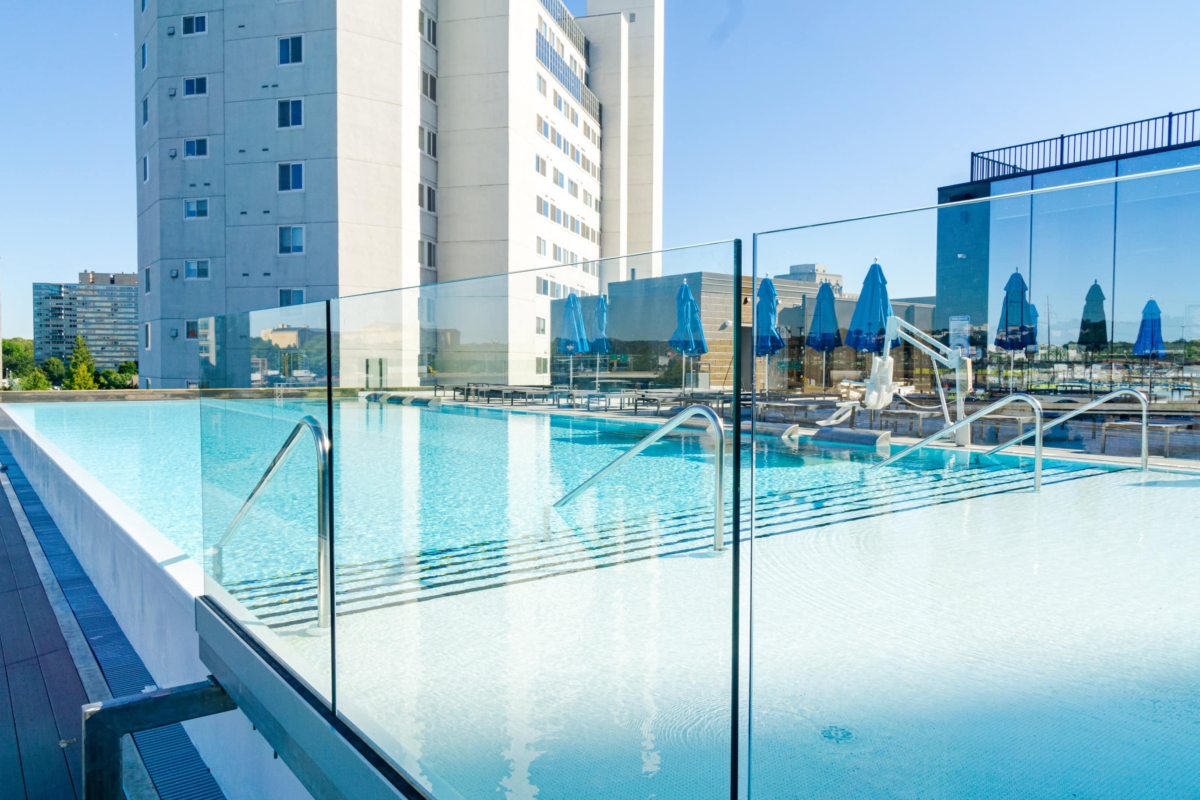 glass fence around rooftop pool