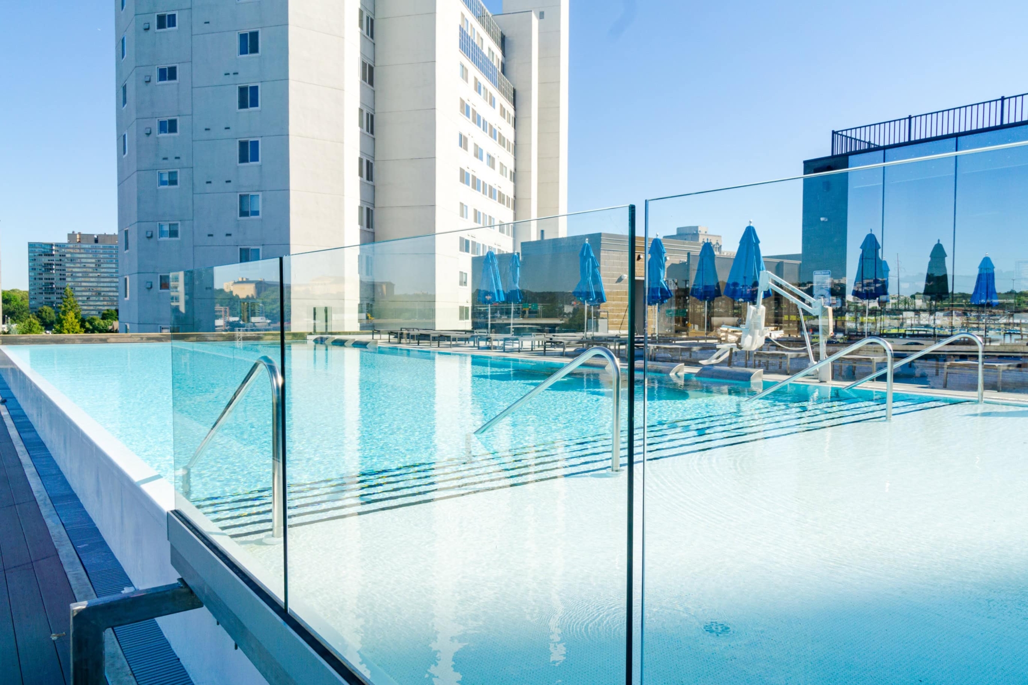glass fence around rooftop pool