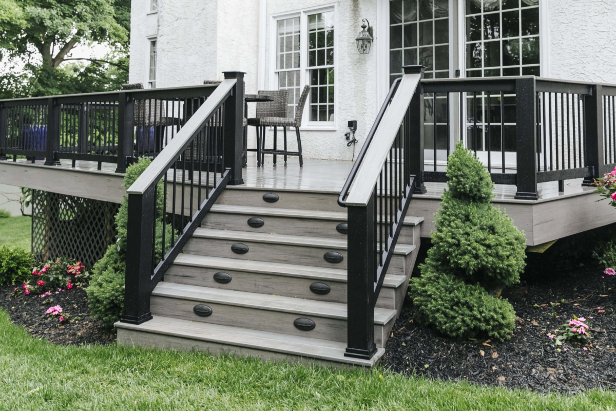 black railing with drink rail on deck