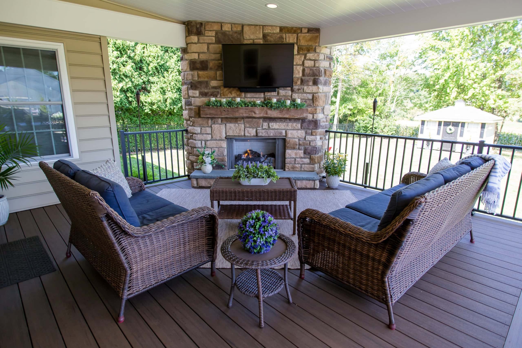 Earth-Tone Deck with Stone Fireplace - West Chester, PA - Integrous ...
