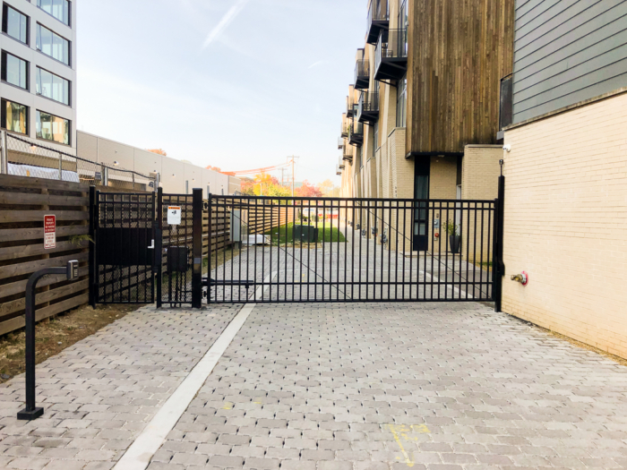 black metal automated entrance gate