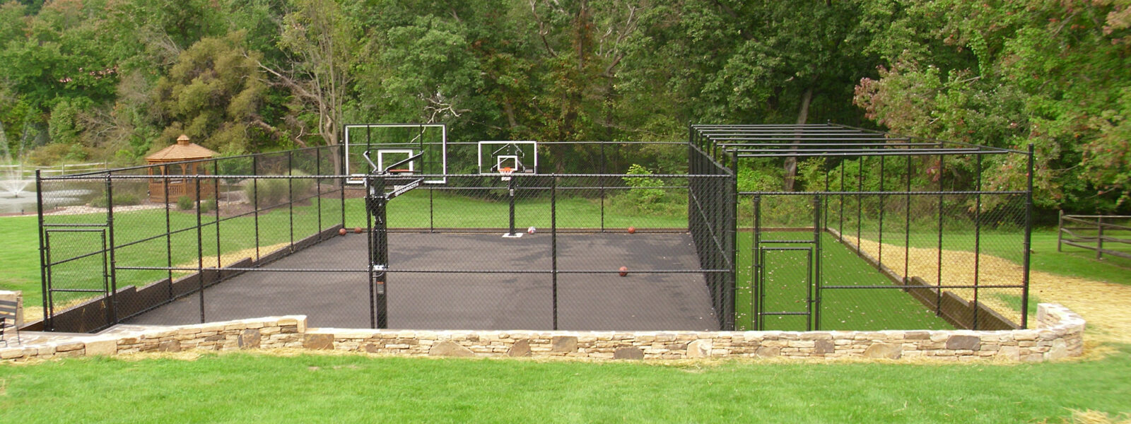 Chain link fence around sports court at a residence