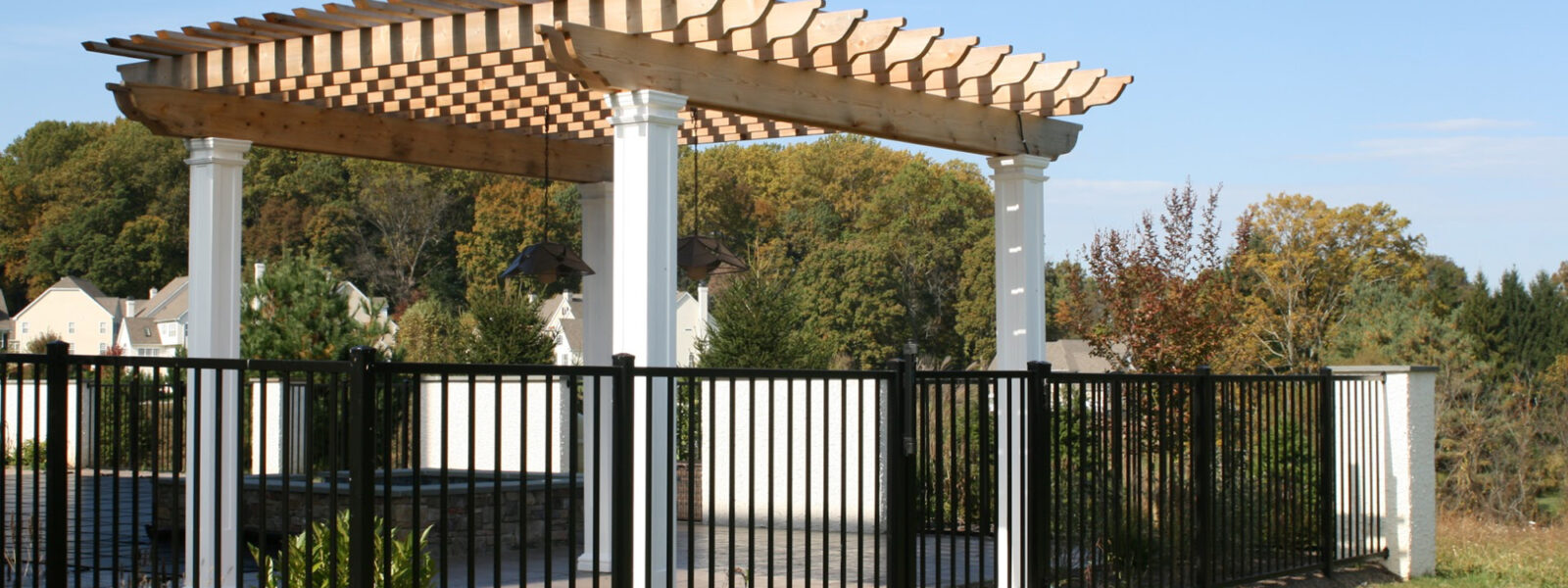 black ornamental metal fence around swimming pool