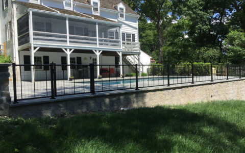 black ornamental fence around pool