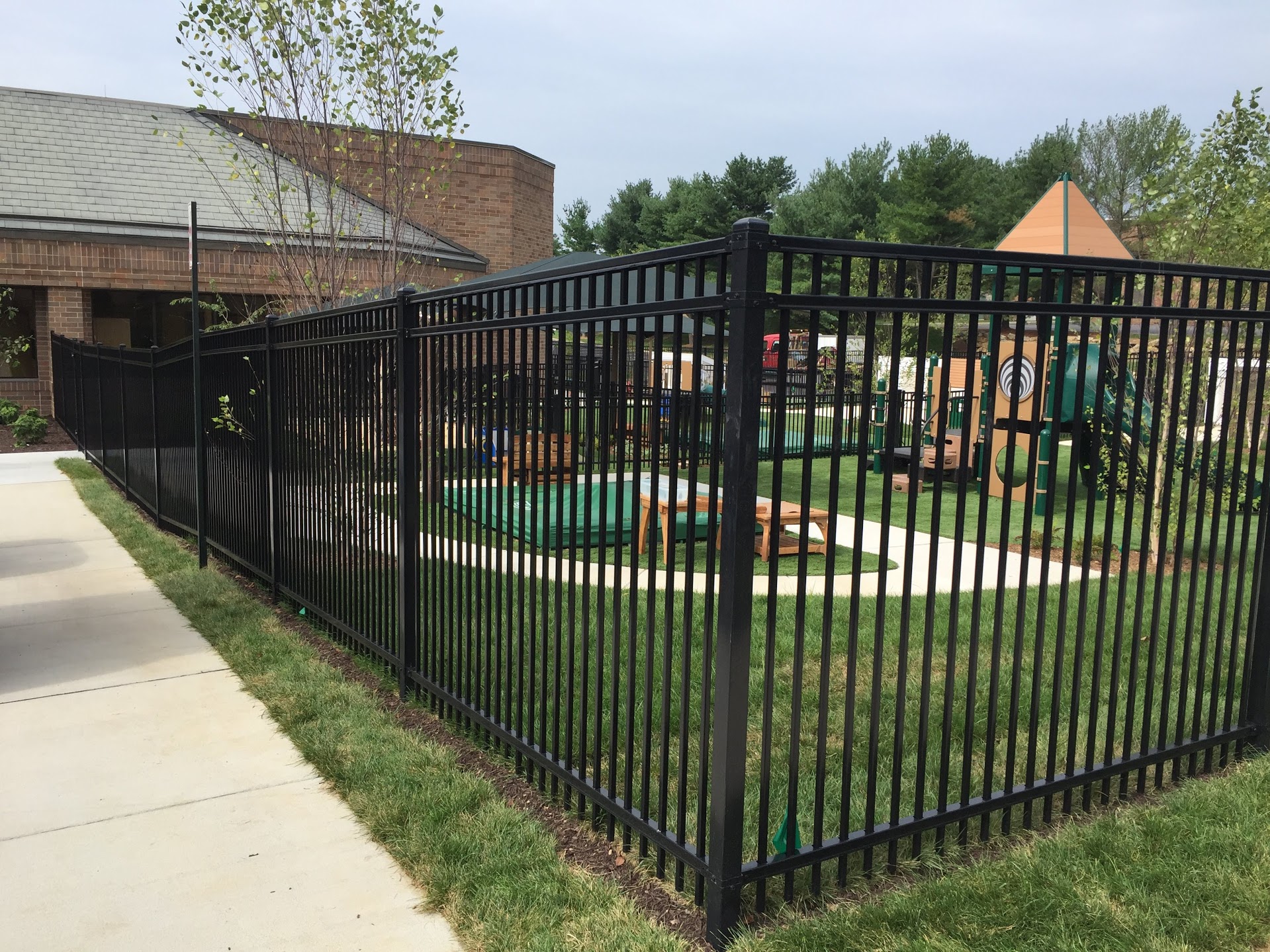 black commercial fence around playground