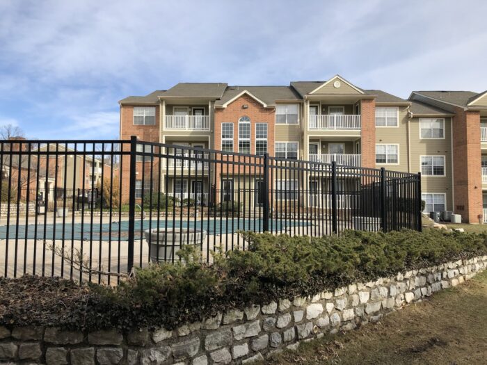 black commercial fence around pool