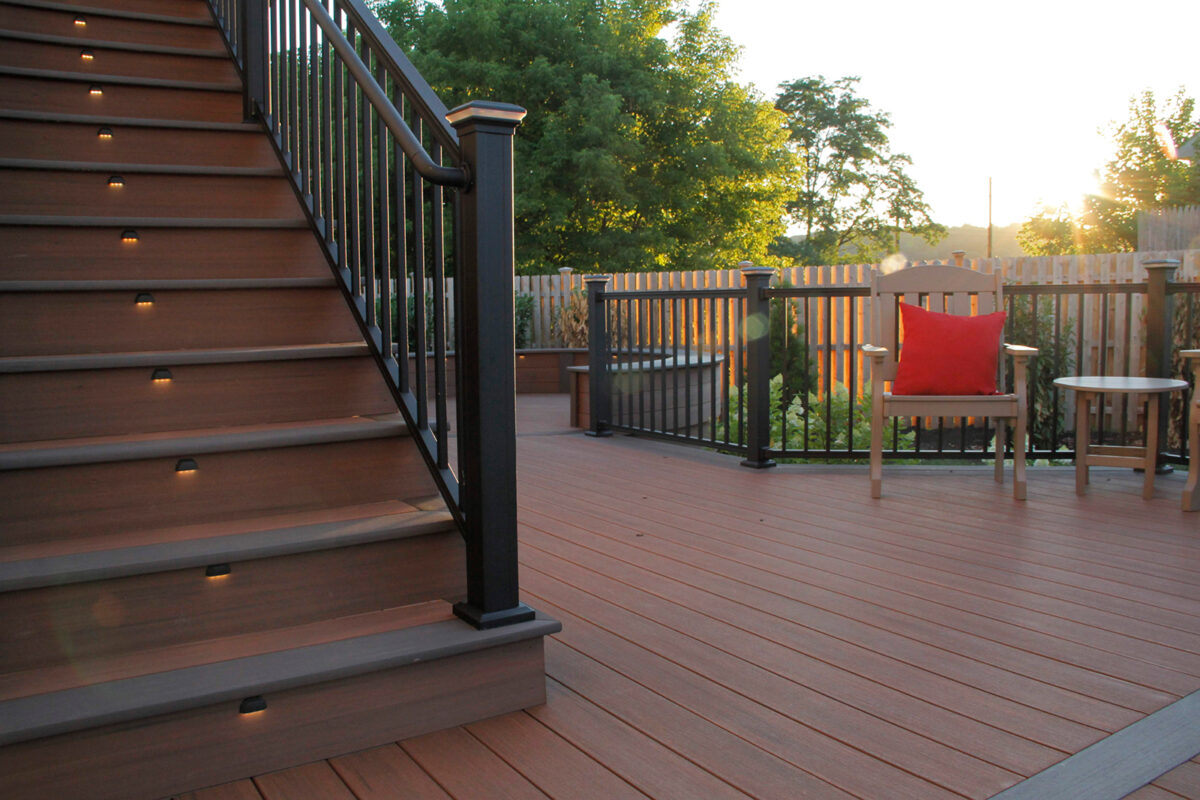 deck with railing and lights