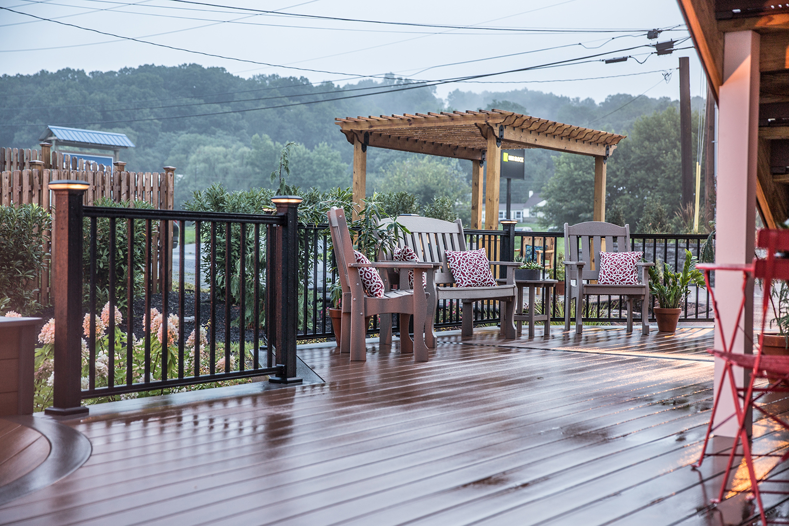 deck with lighted railing and furniture