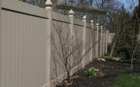 khaki privacy fence in back yard