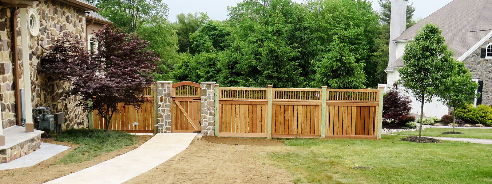 wooden fence with arched gate