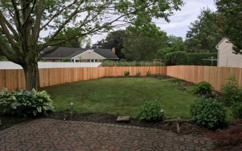 wood sounds abatement fence in yard