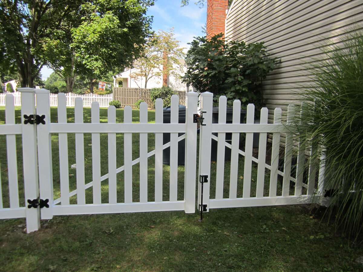 white vinyl picket fence with double gate