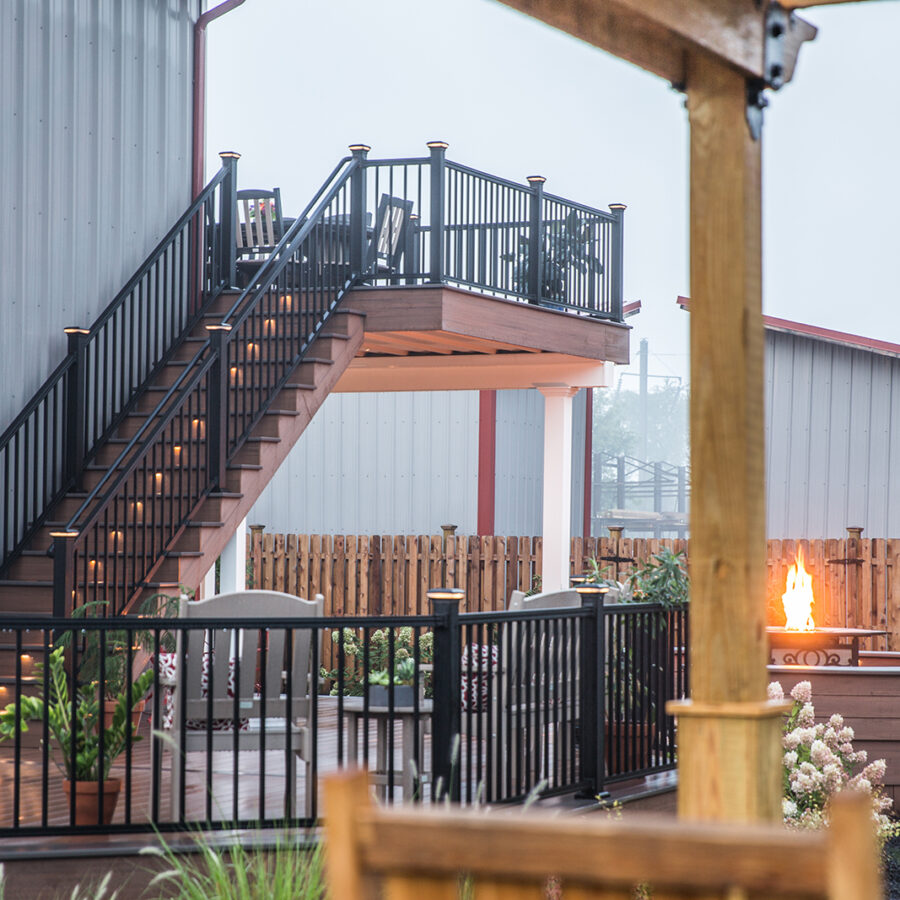 lighted stairs on deck with fireplace