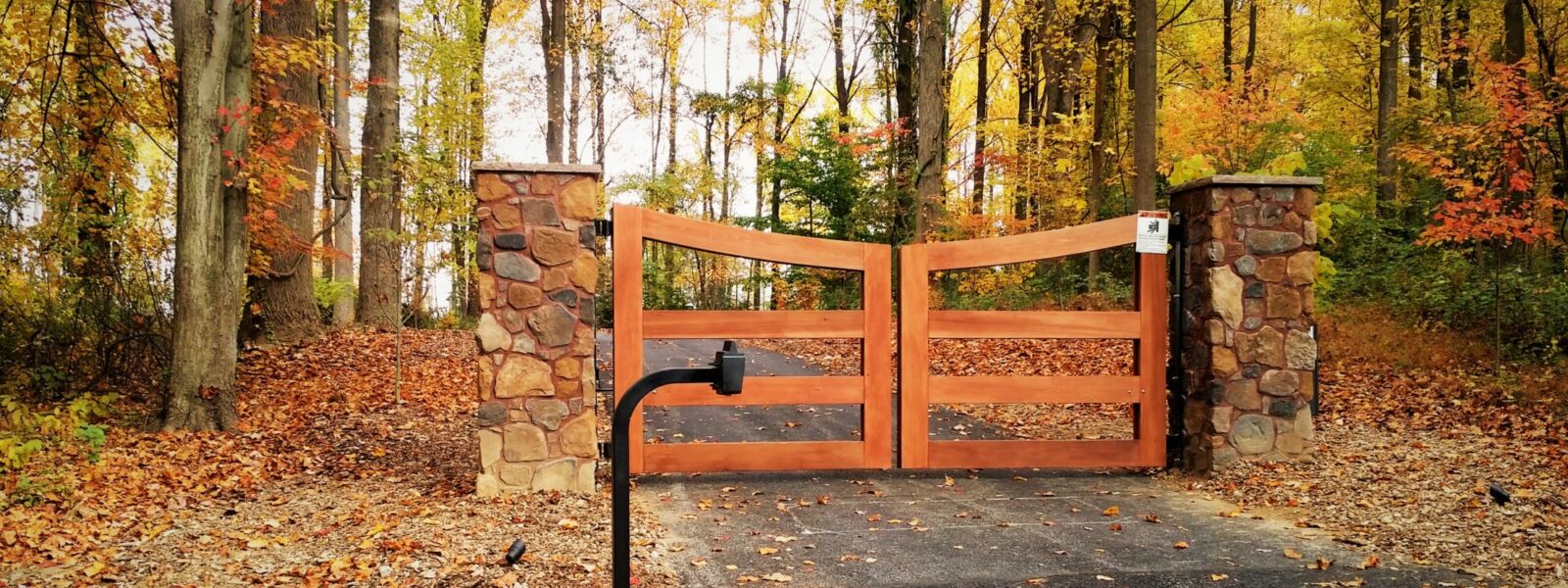 wood rail driveway gate with automated opener