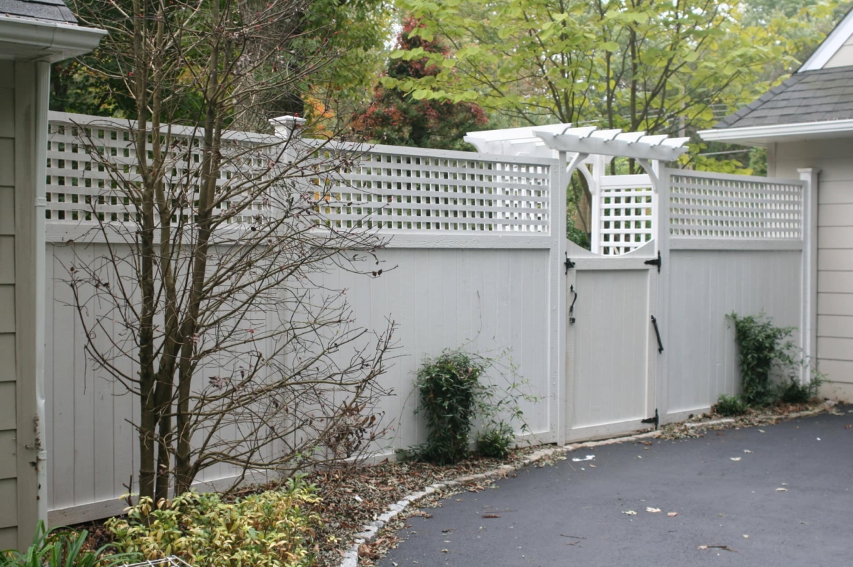 7' tall framed lattice topped fencing with arbor