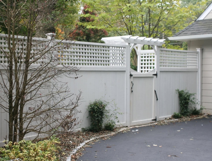 7' tall framed lattice topped fencing with arbor