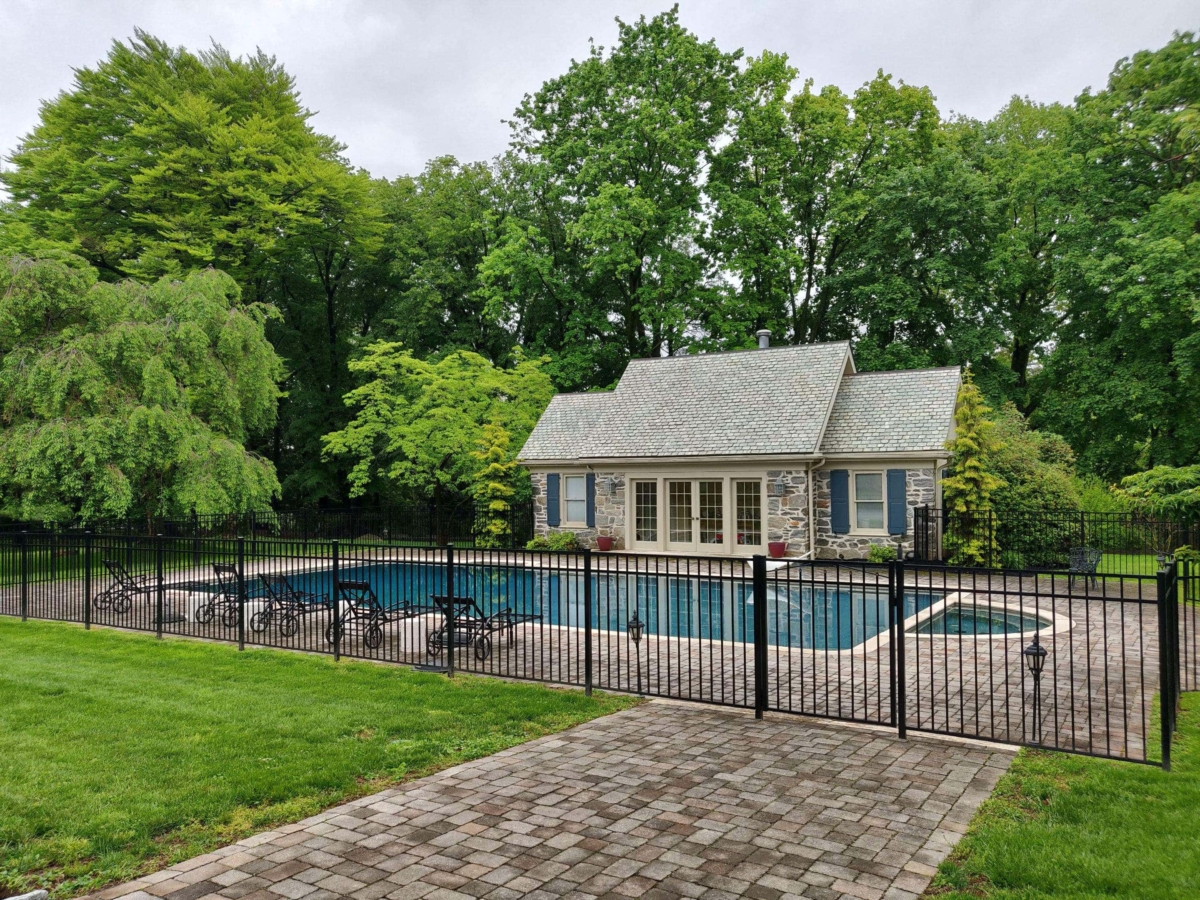 black metal fence around pool