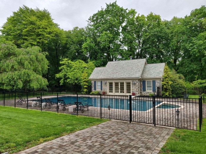 black metal fence around pool