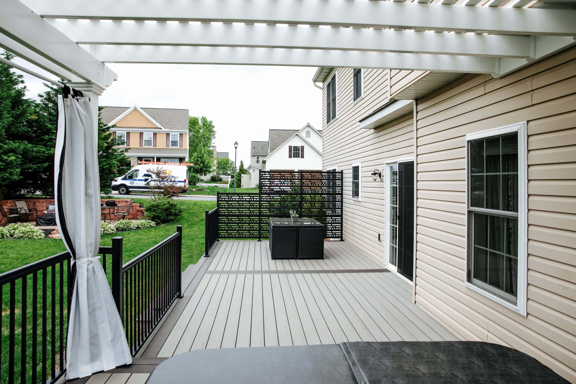 white vinyl pergola over TimberTech deck
