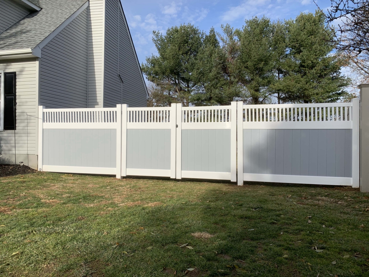 gray and white vinyl privacy fence