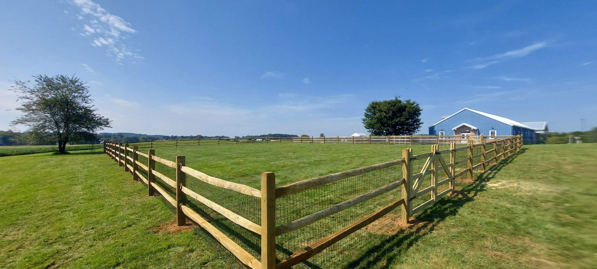 wood split rail fence with wire mesh
