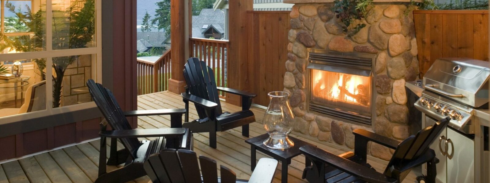 Outdoor seating area with fireplace and grill