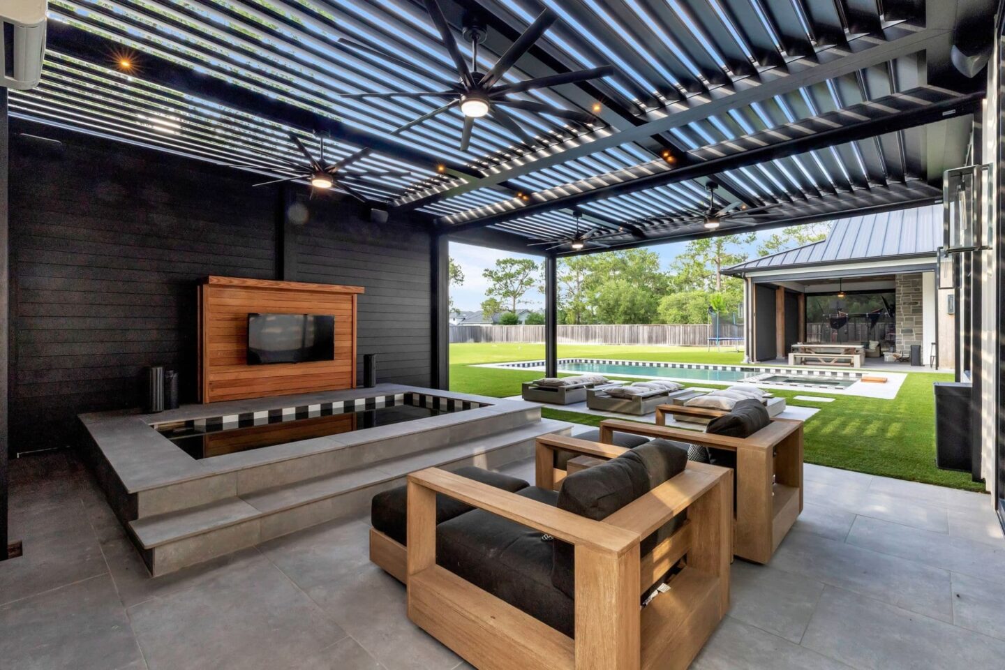 Black R-Blade Louvered Pergola with Privacy Wall