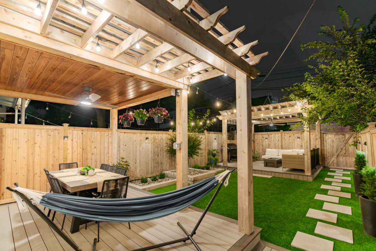 image of a backyard in lancaster city pa built by integrous fences and decks featuring two cedar pergolas multiple decks and beautifully designed landscaping